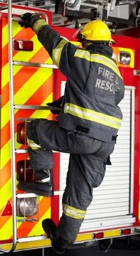 Firefighter, man and climbing ladder for emergency operation, service or rescue Stock Photos