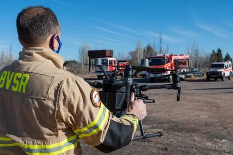 Firefighter operating drone in search and rescue Stock Photos