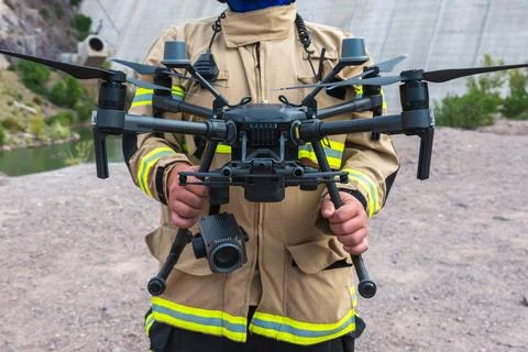 Firefighter operating drone in search and rescue Stock Photos