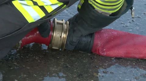A firefighter prepares the hydrant Stock Footage 62124101