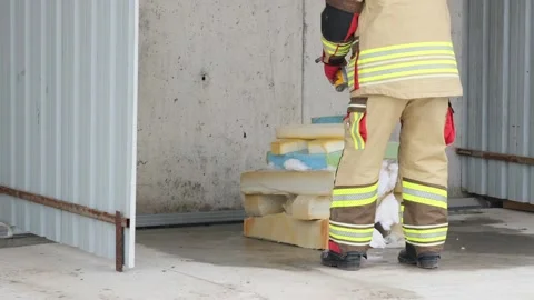 Firefighter Preparing Flammable Materials for Fire Test Stock Footage 301052306