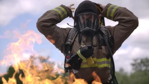 Firefighter prepping to battle a blaze close up Stock Footage 299161495
