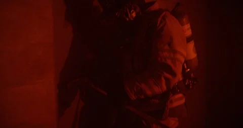 Firefighter prying open a door during training Stock Footage 107624365