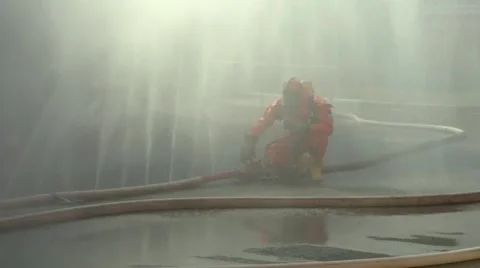 A firefighter puts a water barrier Stock Footage 48330064