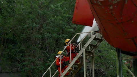 Firefighter Rescue team training in fire fighting extinguisher Stock Footage 276349411