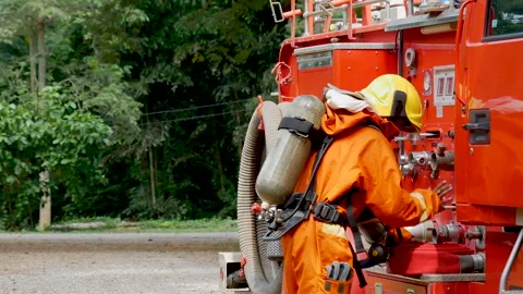 Firefighter Rescue team training in fire fighting extinguisher Stock Footage 279958542