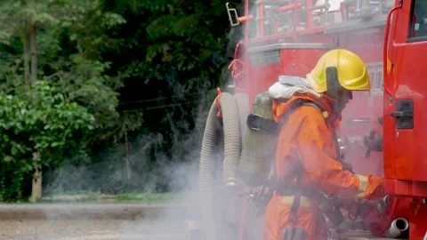 Firefighter Rescue team training in fire fighting extinguisher Stock Footage 279958961