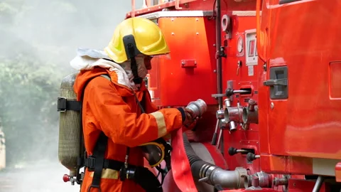Firefighter Rescue team training in fire fighting extinguisher Stock Footage 279959396