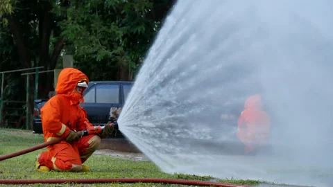 Firefighter Rescue team training in fire fighting extinguisher Stock Footage 279960024