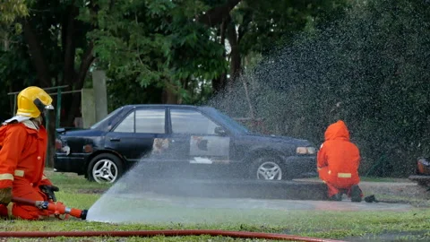 Firefighter Rescue team training in fire fighting extinguisher Stock Footage 279960057