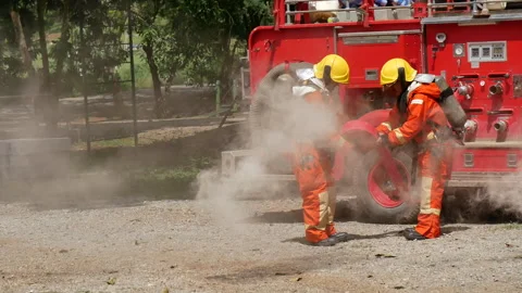 Firefighter Rescue team training in fire fighting extinguisher Stock Footage 279960905