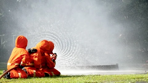 Firefighter Rescue training in fire fighting extinguisher. Firefighter fighting  Video stock 208831732