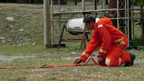 Firefighter Rescue training in fire fighting extinguisher. Stock Footage 276719937