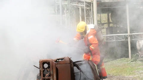 Firefighter Rescue training in fire fighting extinguisher. Stock Footage 276721012
