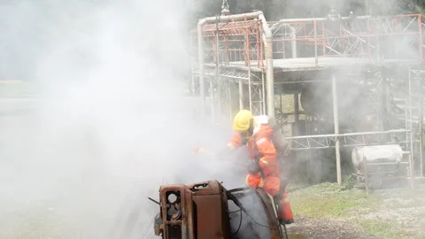 Firefighter Rescue training in fire fighting extinguisher. Stock Footage 276721013