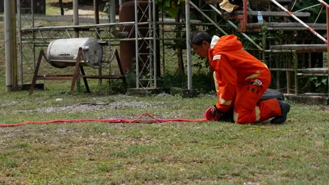 Firefighter Rescue training in fire fighting extinguisher. Stock Footage 276721122
