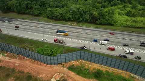 Firefighter Rescues Car Fire Emergency on Busy Highway Stockbeeldmateriaal 337330482