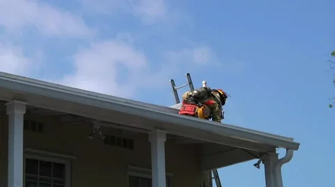 Firefighter on roof Stock Footage 932182
