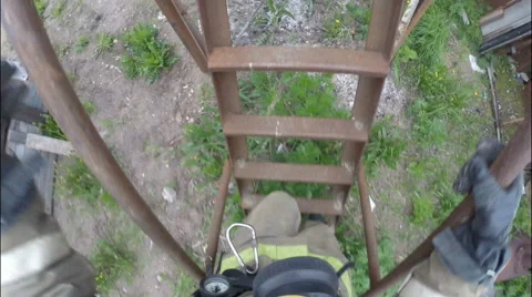 Firefighter runs up the stairs and down the pole in a gas mask. Stock Footage 67857202