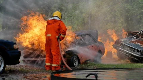 Firefighter safety protect danger from fire flame heat using water equipment. Video stock 112603710