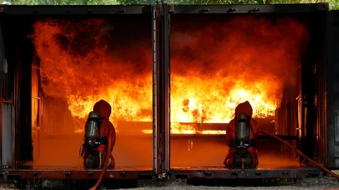 Firefighter safety protect danger from fire flame heat using water equipment. Stock Footage 112737148