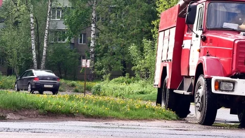 Firefighter screws a fire hydrant into a sewer hatch to get water. Stock Footage 109388559
