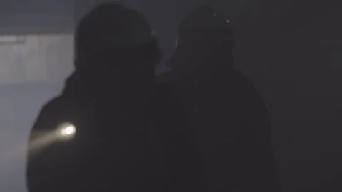 Firefighter Shines His Flashlight Into A Dark House Stock Footage 266405473