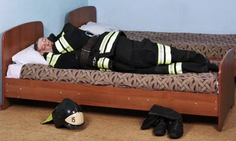 Firefighter sleeps Stock Photos
