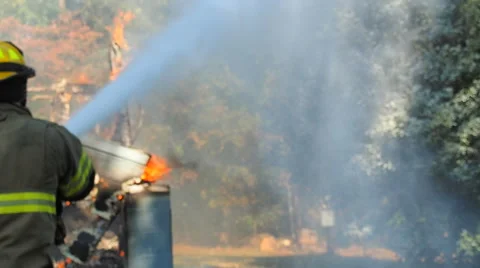 Firefighter sparying foam Video stock 68959136