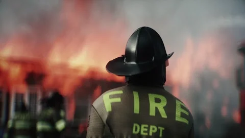 Firefighter Standing in Front of Burning House Surrounded by Flames 스톡 동영상 336516100