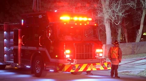 Firefighter Standing Next to Fire Truck Stock Footage 61803593