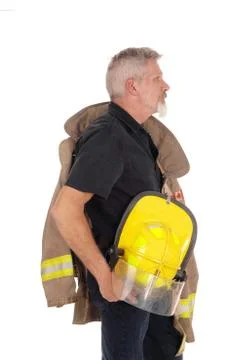 A firefighter standing in profile Stock Photos