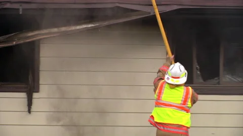 Firefighter takes off house shards 2 Stock Footage 46970680