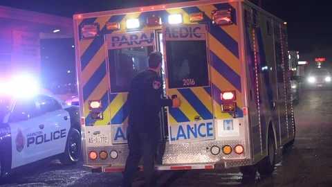 Firefighter Talking To Paramedics At Ambulance Stock Footage 104373318