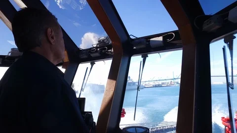 Firefighter talking on phone from Fireboat 2 on the Port of Los Angeles Stock Footage 116505676