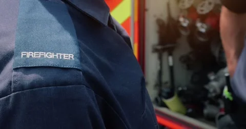 Firefighter team - firemen with emergency services firefighting crew uniform Stock Footage 342915385