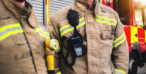 Firefighter team - firemen equipped with emergency services firefighting uniform 스톡 사진