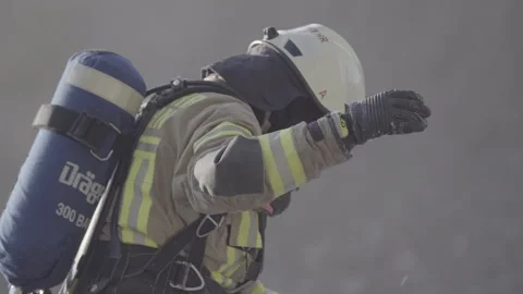 Firefighter training to extinguish a wrecked car Stock Footage 266883100