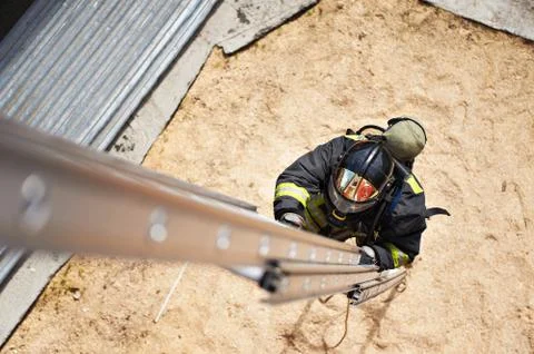 Firefighter in training with the fire stairs Stock Photos