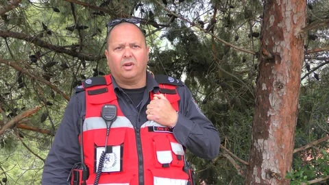 A firefighter using communications instrument in his pocket Stock Footage 106693614