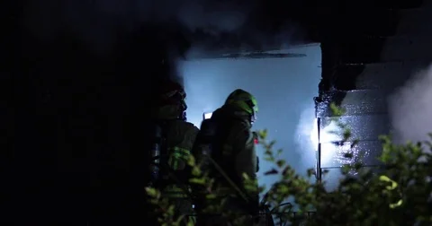 Firefighter using thermal imaging camera at house fire Stock Footage 78875724