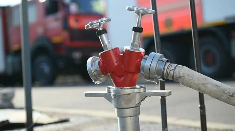 Firefighter water hose connected to hydrant 스톡 동영상 65190143