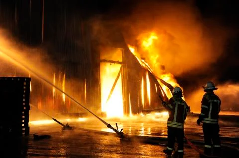 Firefighters in action Stock Photos