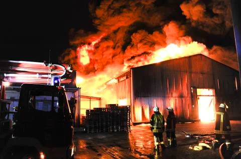 Firefighters in action Stock Photos