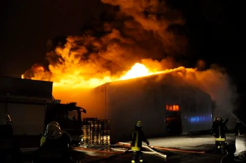 Firefighters in action Stock Photos