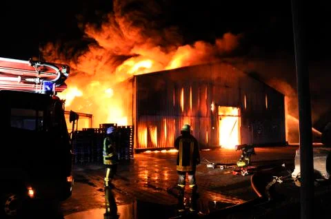 Firefighters in action Stock Photos
