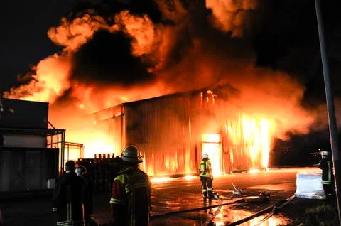 Firefighters in action Stock Photos