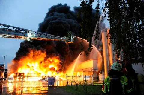 Firefighters in action Stock Photos
