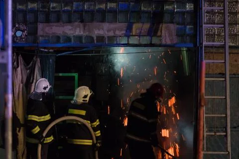 Firefighters in action Stock Photos