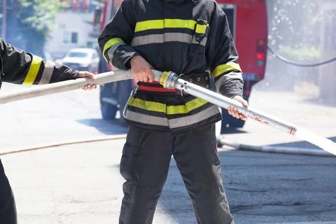 Firefighters in action Stock Photos